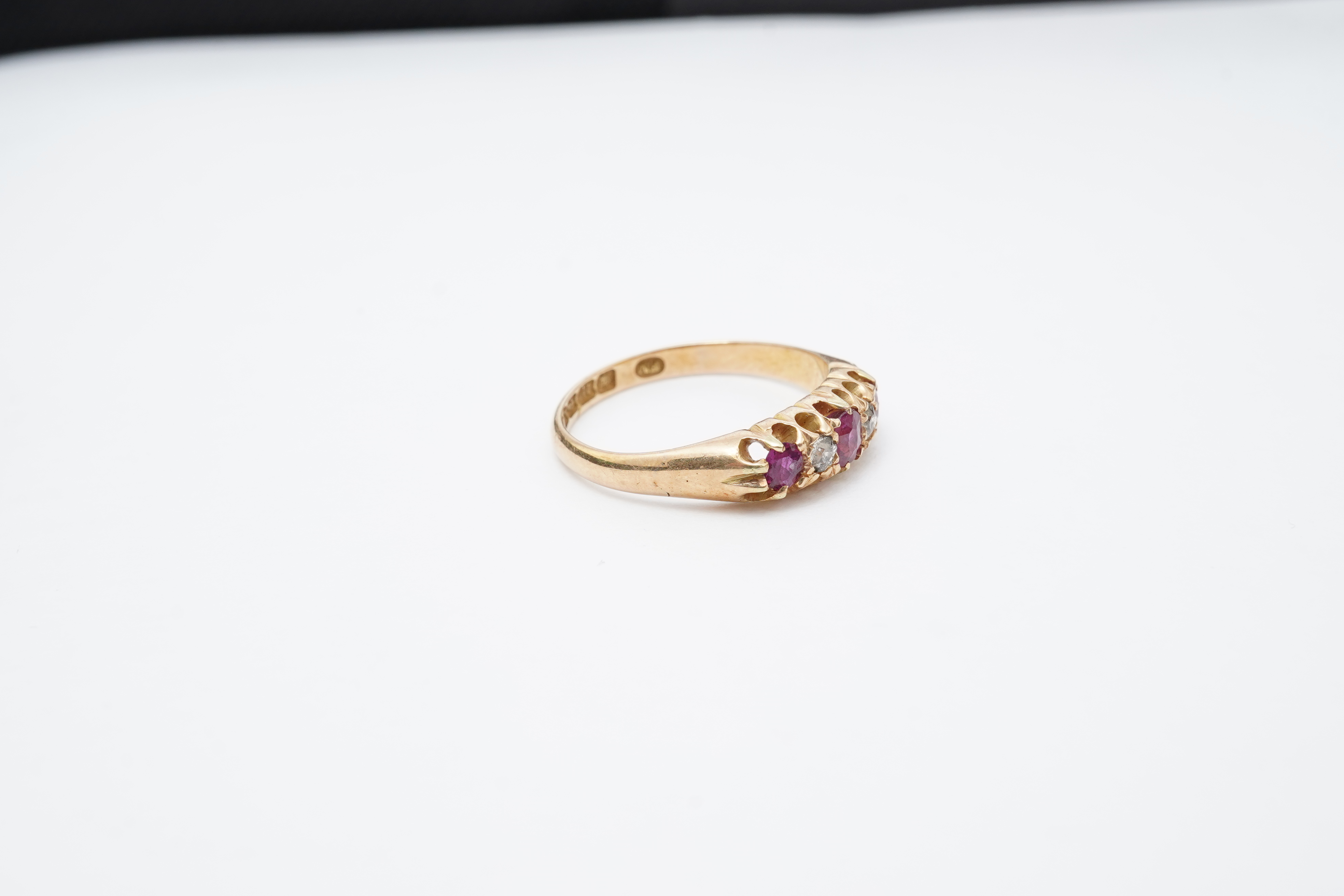 A ruby and diamond five-stone ring, circa 1900